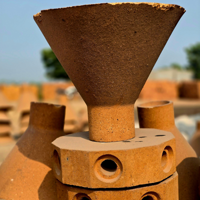 Funnel shaped refractory brick for steel industry